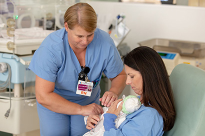 Jill Byrne, RN, assisting with skin to skin care in the Mountain View Hospital NICU