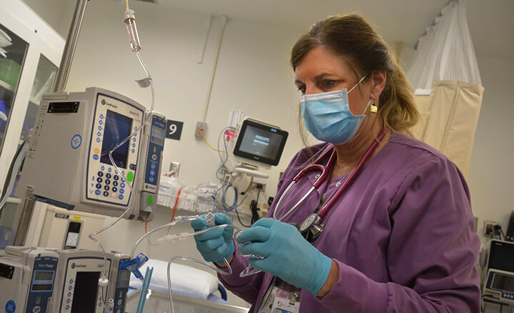 Nurse examining sample in medical office