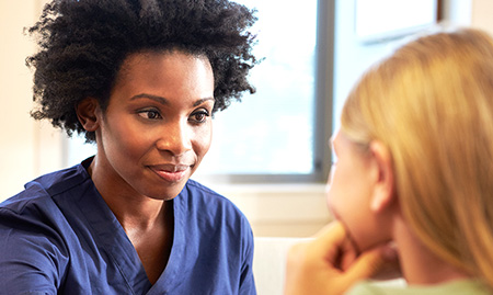 African American Woman Consulting Child