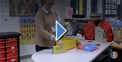 Woman Inspecting School Supplies