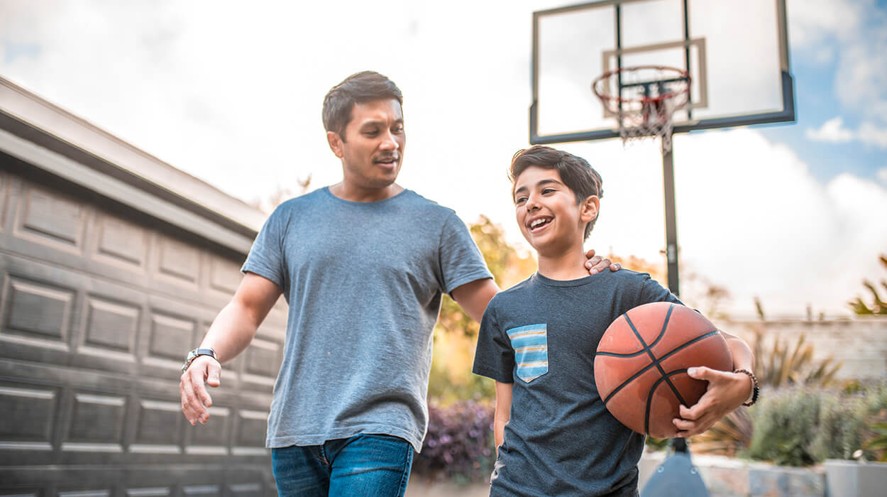 Father and Son playing basketball