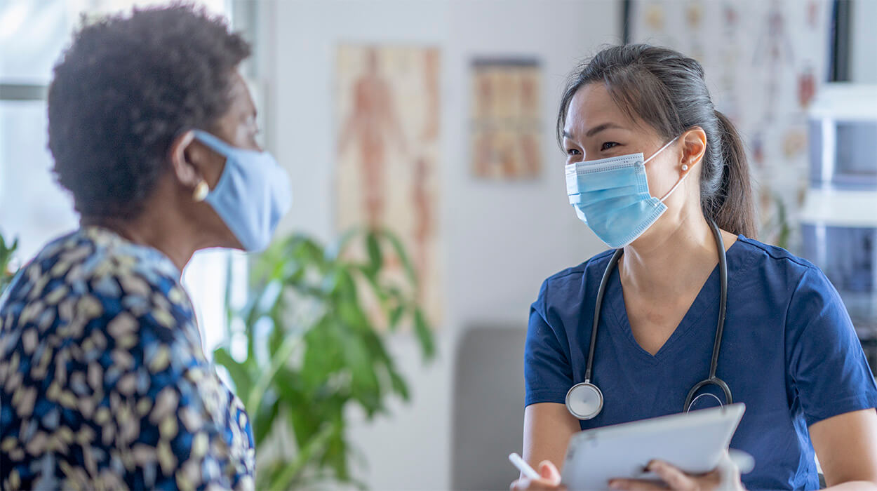 Docotor talking with patient