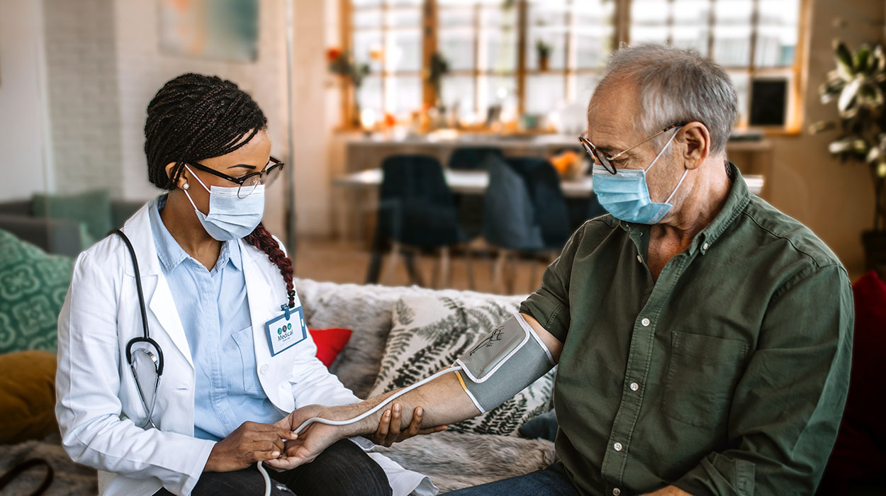 Docotor talking with patient