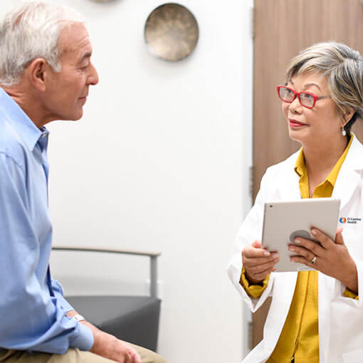 El Camino Health physician consulting a patient.