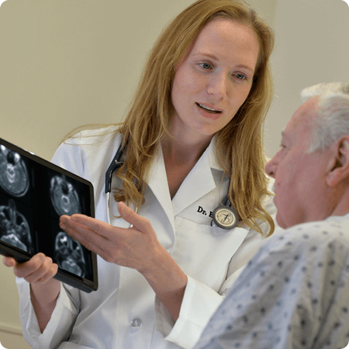 El Camino Health physician reviewing x-rays on a tablet with patient.