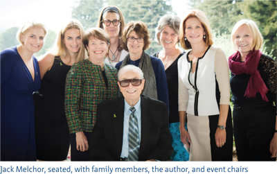 Image of Jack Melchor, seated, with family members, the author and event chairs