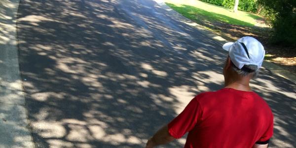 Image of man walking down the street