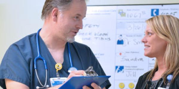 Surgical and Interventional Services - surgeon talking to staff. Surgical and Interventional Services - surgeon talking to staff.