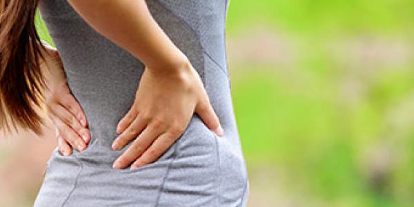 Spine Care - woman arching back Spine Care - woman arching back