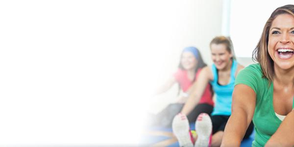 Image of a group engaging in a Laughter Yoga class