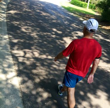 Image of man walking down the street