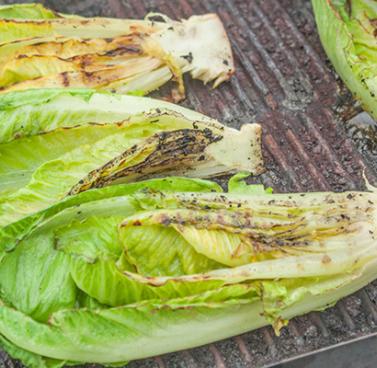 Fresh Romaine Lettuce Grilling on a Barbecue